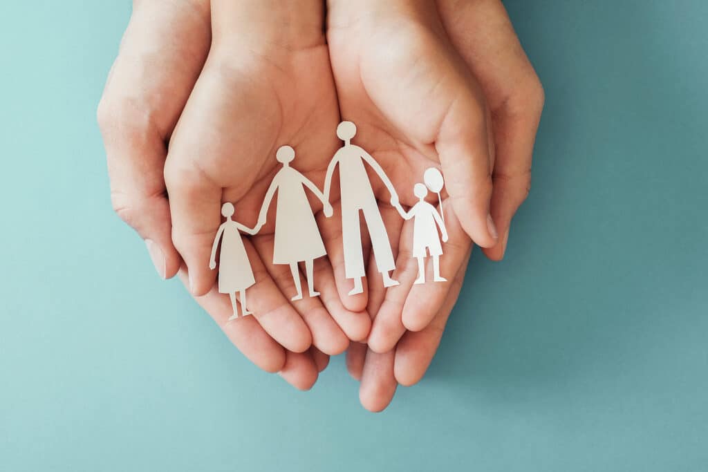 Adult And Children Hands Holding Paper Family Cutout, Family Home